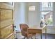 Charming office nook with a wood desk, comfortable chair, and a view from the bright window at 523 N Main St, Graham, NC 27253