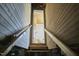 Stairway showcasing exposed wooden beams, leading to a room, suggesting rustic charm and potential at 523 N Main St, Graham, NC 27253
