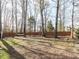 Spacious backyard with mature trees and wood fence at 543 Chatham Forest Dr, Pittsboro, NC 27312