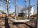 Shaded backyard with wood fence, hammock and exterior view of home at 543 Chatham Forest Dr, Pittsboro, NC 27312