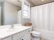 Bright bathroom with white vanity, framed mirror, updated fixtures, and tub with shower at 543 Chatham Forest Dr, Pittsboro, NC 27312
