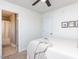 Cozy bedroom with ceiling fan, carpeted floor and doorway view of the attached bathroom at 543 Chatham Forest Dr, Pittsboro, NC 27312