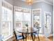 Cozy breakfast nook with a round table and multiple windows, perfect for enjoying morning light at 543 Chatham Forest Dr, Pittsboro, NC 27312