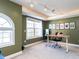 Bright office space with unique lighting fixtures, large windows, and a comfortable workspace at 543 Chatham Forest Dr, Pittsboro, NC 27312