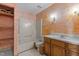 Full bathroom featuring a shower, toilet, sink, and wooden cabinets at 5437 Grasshopper Rd, Raleigh, NC 27610