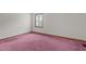Bedroom with purple carpet and a window at 5437 Grasshopper Rd, Raleigh, NC 27610