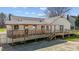 A well-maintained home with a covered deck, ideal for outdoor relaxation and entertaining guests at 5437 Grasshopper Rd, Raleigh, NC 27610