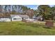 Charming home with a well-maintained lawn and wooden ramp leading to the entrance at 5437 Grasshopper Rd, Raleigh, NC 27610