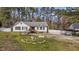 Exterior view of a home with a wooden ramp and decorative yard ornaments at 5437 Grasshopper Rd, Raleigh, NC 27610
