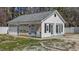 Garage features white siding with weather proofing material at 5437 Grasshopper Rd, Raleigh, NC 27610