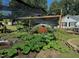 Well-maintained garden with a large pumpkin under protective netting at 5437 Grasshopper Rd, Raleigh, NC 27610