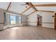 Spacious living room boasts vaulted ceilings with exposed beams and large bay window at 5437 Grasshopper Rd, Raleigh, NC 27610