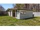 Backyard shed with siding and awning at 5437 Grasshopper Rd, Raleigh, NC 27610