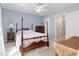 Bedroom has light-blue walls and standard height ceiling and wood furnishings at 5569 Sea Daisy Dr, Raleigh, NC 27606