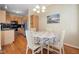Kitchen dining area with table, chairs, and natural light near the kitchen appliances and storage at 5569 Sea Daisy Dr, Raleigh, NC 27606