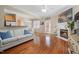 Bright living room featuring fireplace, hardwood floors, and dining area with ample seating at 5569 Sea Daisy Dr, Raleigh, NC 27606