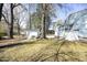 Backyard featuring a storage shed and mature trees at 608 Cecil St, Durham, NC 27707