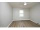 Bedroom featuring a ceiling fan, a window for natural light and wood flooring at 608 Cecil St, Durham, NC 27707