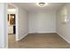 Bright dining room with modern lighting, neutral walls, and hardwood floors, perfect for Gathering meals at 608 Cecil St, Durham, NC 27707