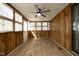 Bright enclosed porch with abundant windows and ceiling fan at 608 Cecil St, Durham, NC 27707