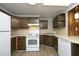 Cozy kitchen with practical appliances, wooden cabinets, and tile accents, perfect for everyday cooking at 608 Cecil St, Durham, NC 27707