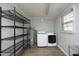Functional laundry area featuring modern washer, dryer, and ample storage at 608 Cecil St, Durham, NC 27707
