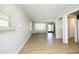 Open living room area with hardwood flooring, neutral walls, and natural light, perfect for entertaining at 608 Cecil St, Durham, NC 27707