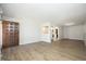 Spacious living room with wood flooring, neutral paint, and an open layout, creating a warm atmosphere at 608 Cecil St, Durham, NC 27707