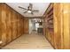 Spacious living room featuring wood paneled walls and access to kitchen at 608 Cecil St, Durham, NC 27707