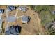 Overview of the landscaped neighborhood featuring spacious lots, mature trees, and distinctive home styles at 6108 Norwood Place Ct, Raleigh, NC 27613