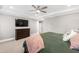 Comfortable bedroom with ceiling fan, trey ceiling and large dresser at 6108 Norwood Place Ct, Raleigh, NC 27613