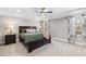 Primary bedroom with trey ceiling, plush carpet, and ample natural light at 6108 Norwood Place Ct, Raleigh, NC 27613