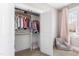 Organized closet featuring hanging clothes on two levels with a high window offering natural light at 6108 Norwood Place Ct, Raleigh, NC 27613