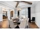 Bright dining area with a stylish table, comfortable seating, and ample natural light, great for entertaining guests at 6108 Norwood Place Ct, Raleigh, NC 27613