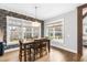 Dining room features hardwood floors, natural light, and decorative wallpaper at 6108 Norwood Place Ct, Raleigh, NC 27613