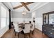 Elegant dining area with a large table, sophisticated lighting, and a view into the kitchen, perfect for Gathering meals at 6108 Norwood Place Ct, Raleigh, NC 27613