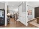 Open-concept entryway with hardwood floors, stairs, and an inviting view into the living area, perfect for entertaining at 6108 Norwood Place Ct, Raleigh, NC 27613