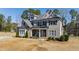 Charming two-story home with stone and siding exterior, well-maintained lawn and inviting entrance at 6108 Norwood Place Ct, Raleigh, NC 27613