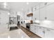 Kitchen featuring stainless steel appliances, a large island with quartz countertop, and custom cabinets at 6108 Norwood Place Ct, Raleigh, NC 27613