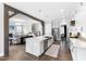 Open kitchen and living room floor plan with an island and stainless steel appliances at 6108 Norwood Place Ct, Raleigh, NC 27613