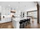 Bright kitchen with stainless steel appliances, white cabinetry, and large island with seating at 6108 Norwood Place Ct, Raleigh, NC 27613