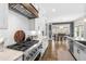 Gourmet kitchen features stainless steel appliances, white cabinets and a view into the dining area at 6108 Norwood Place Ct, Raleigh, NC 27613