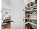 Walk-in pantry with ample shelving and storage space located off of the main living area at 6108 Norwood Place Ct, Raleigh, NC 27613
