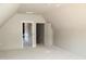Open attic space featuring entry to storage areas and open stud construction at 65 Stream View Way, Spring Hope, NC 27882