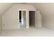 Unfinished attic space, with two doorways, ready for customization at 65 Stream View Way, Spring Hope, NC 27882