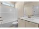 Bathroom featuring a single vanity, toilet, and a shower/tub combo with natural lighting at 65 Stream View Way, Spring Hope, NC 27882