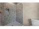 Walk-in shower stall with blue tile, a toilet, and natural lighting at 65 Stream View Way, Spring Hope, NC 27882