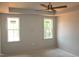 Bright bedroom with tray ceiling and large windows offering natural light at 65 Stream View Way, Spring Hope, NC 27882