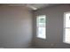 Bedroom with two windows providing natural light and a ceiling fan at 65 Stream View Way, Spring Hope, NC 27882
