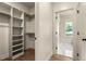 Walk-in closet with custom shelves and hanging rods, providing ample storage space at 65 Stream View Way, Spring Hope, NC 27882